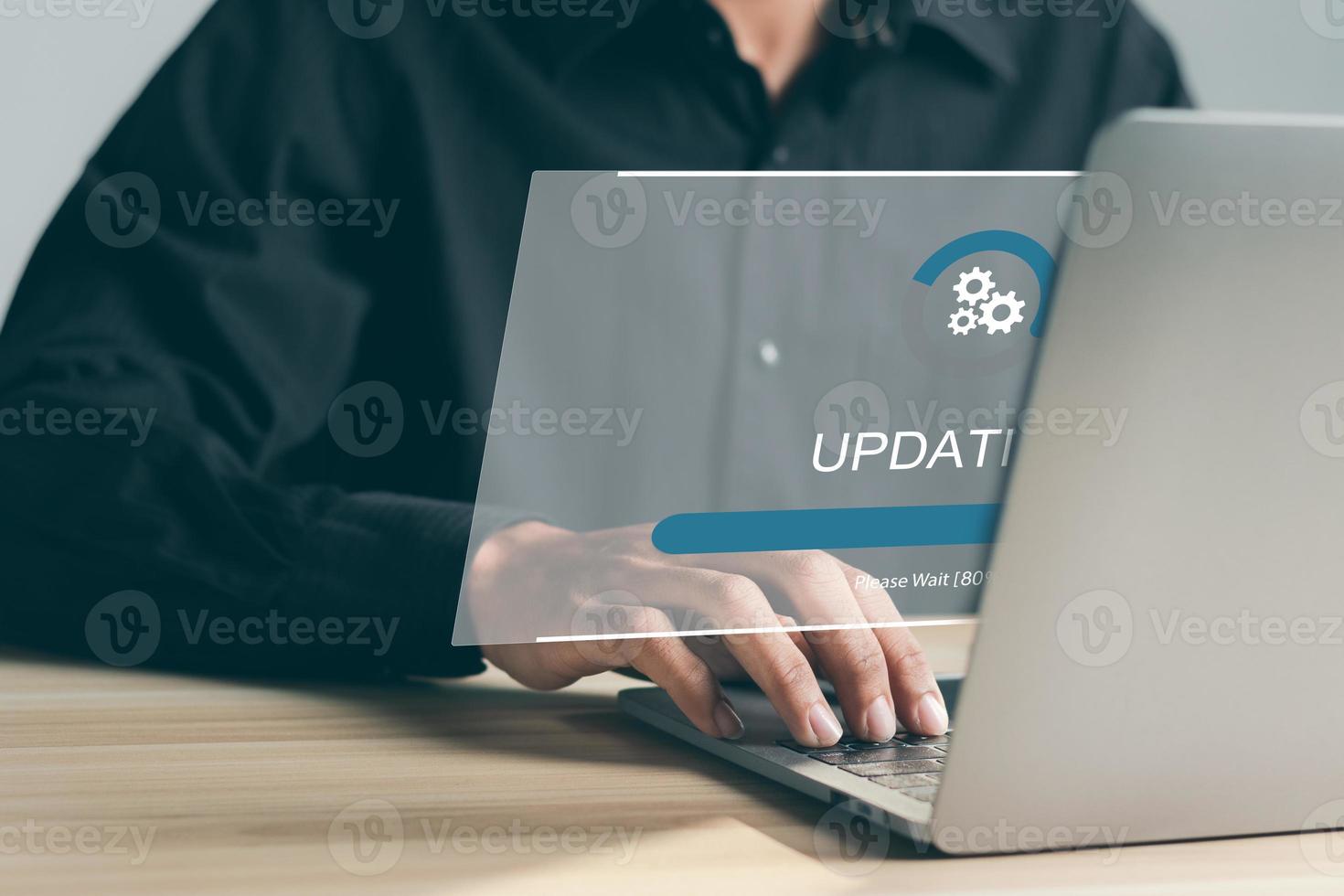 Businessman working and Installing update process. Software update or operating system upgrade to keep the device up to date with added functionality in new version and improve security. photo