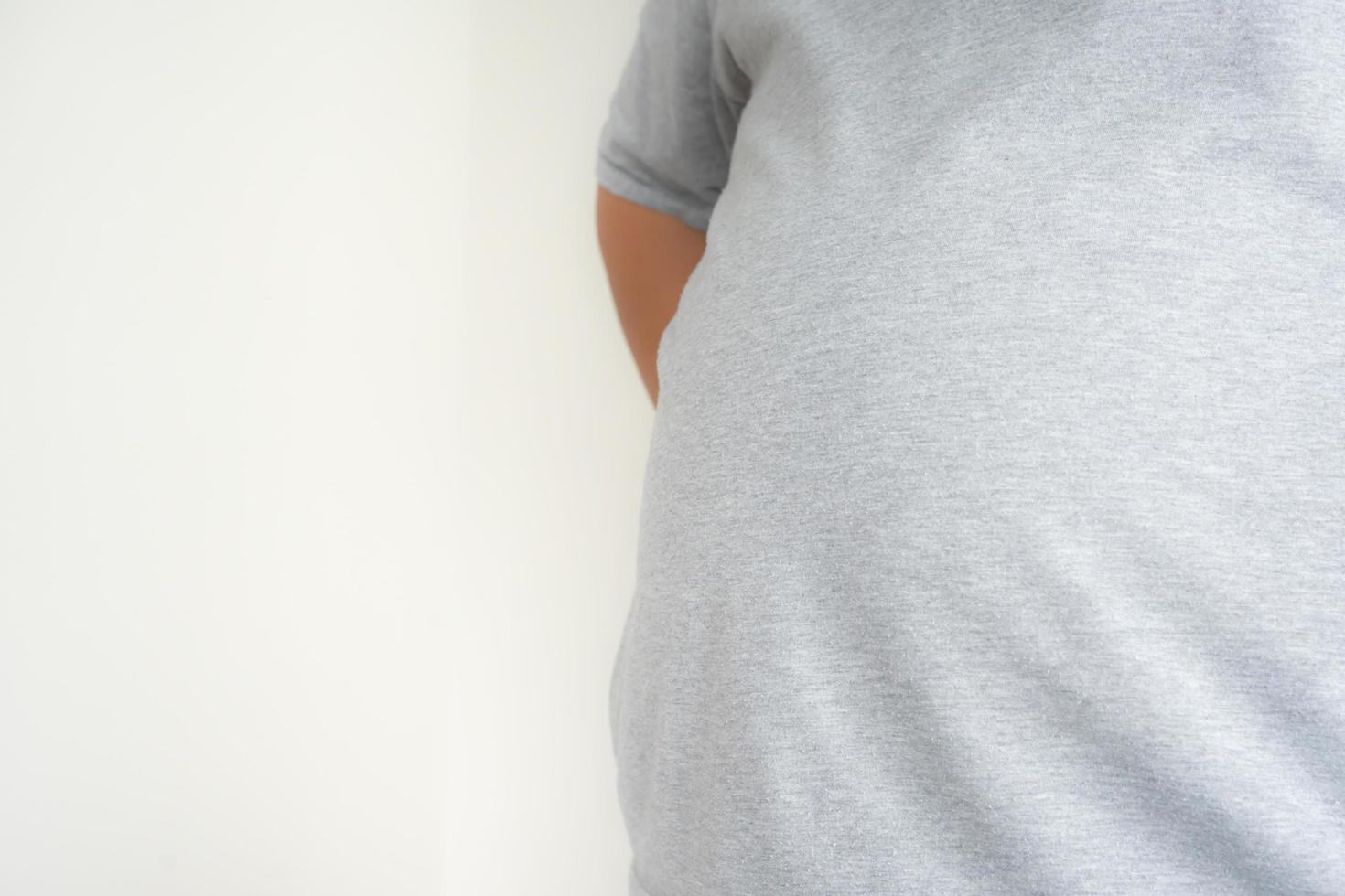 Unhealthy man body concept of obesity need and overweight causing health problem photo