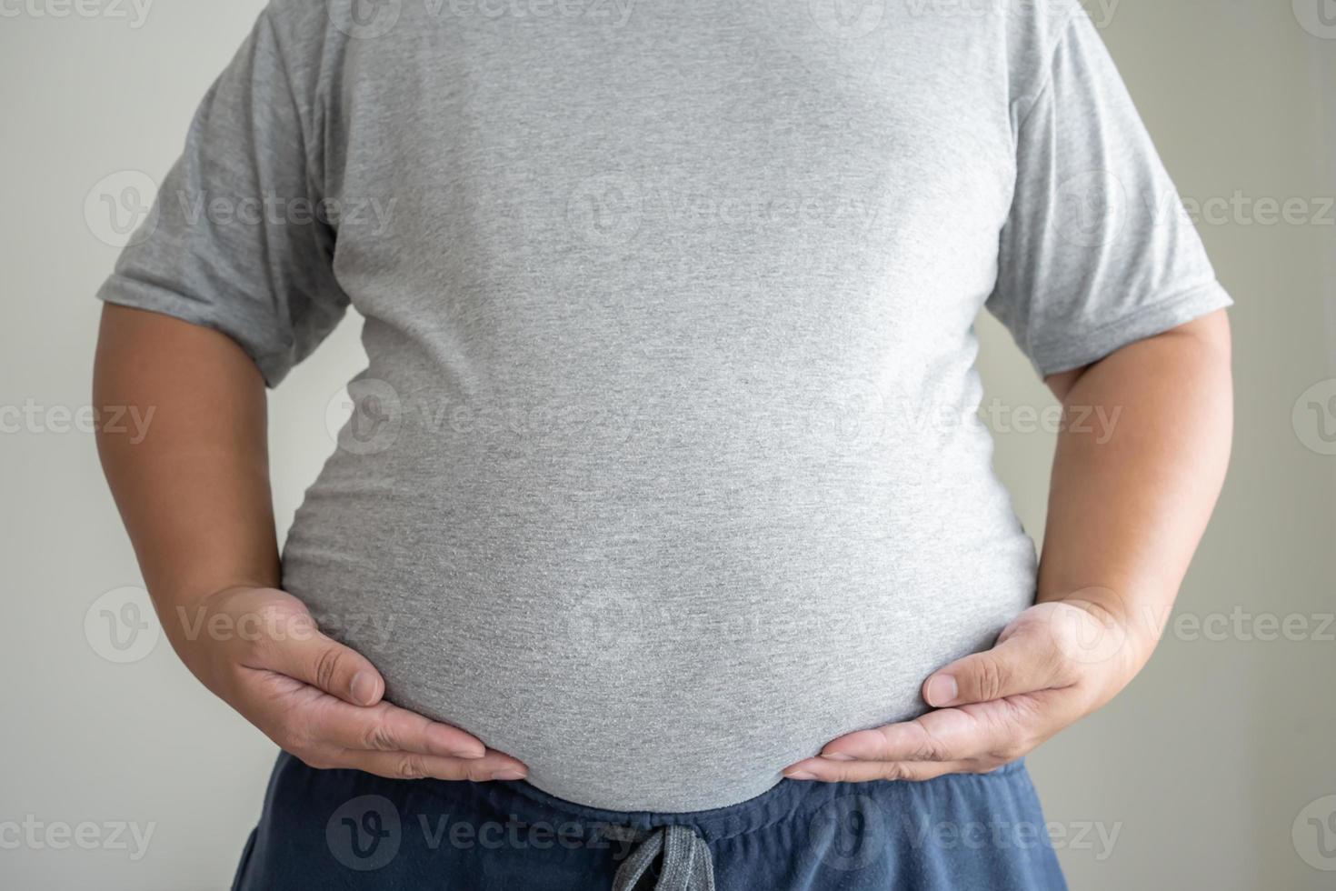 Unhealthy man body concept of obesity need and overweight causing health problem photo