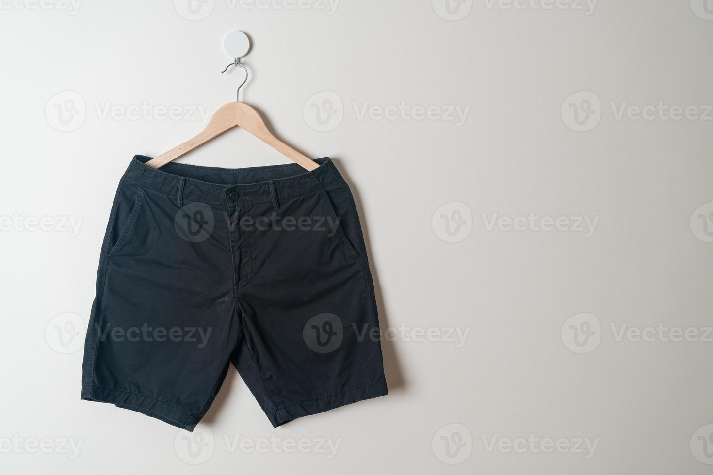 short pants hanging on wall photo