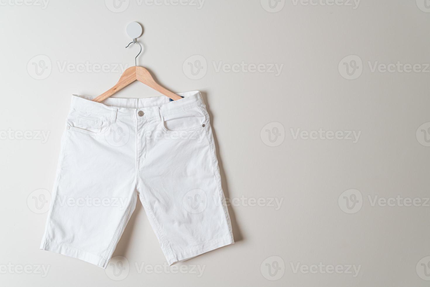 short pants hanging on wall photo