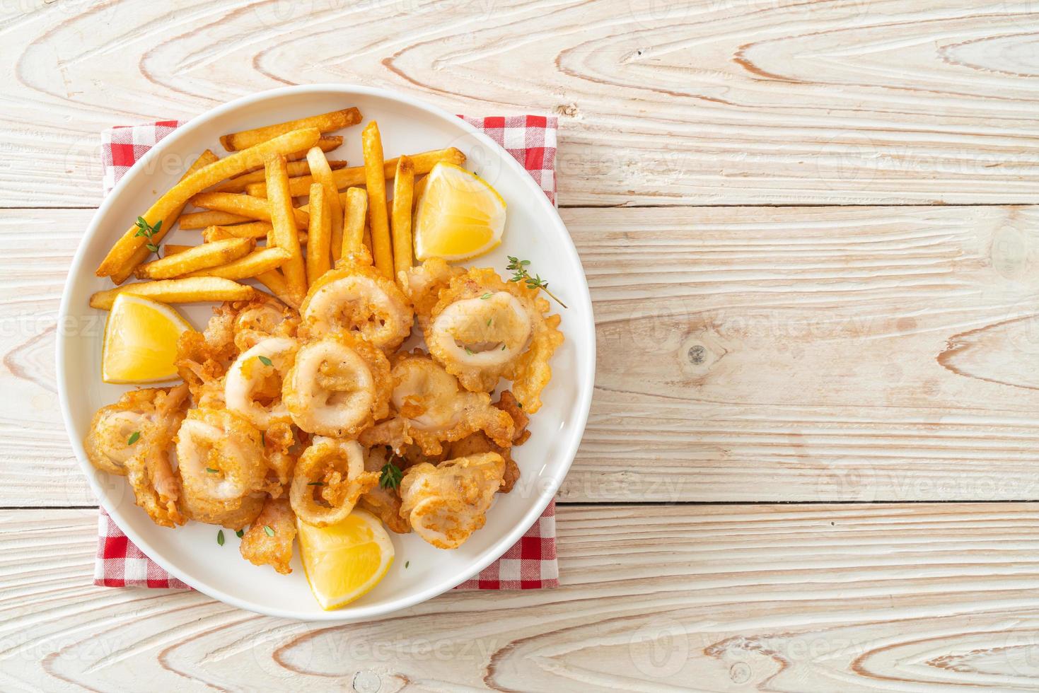 calamari - fried squid or octopus with fries photo