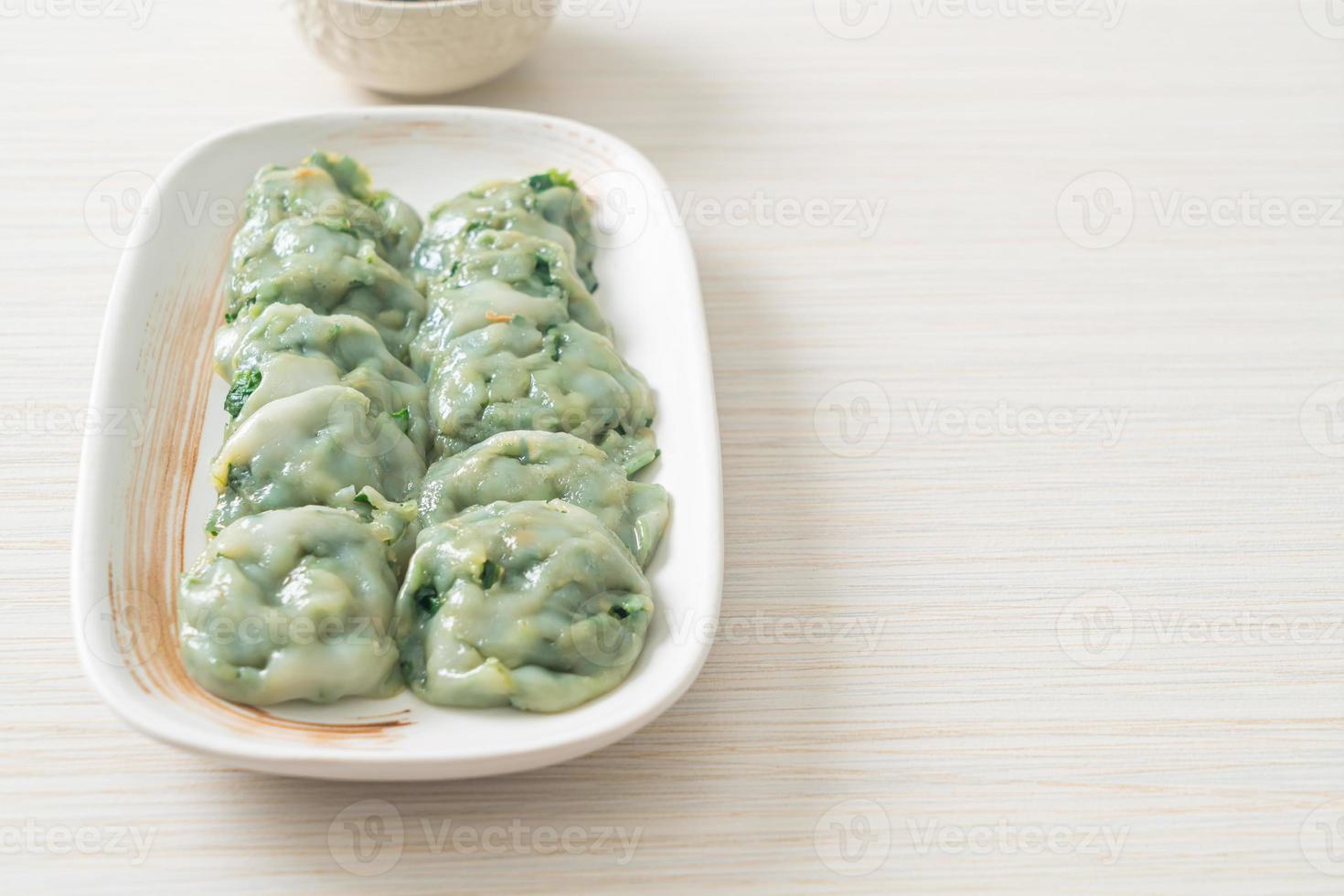 steamed chives dumplings with sauce photo