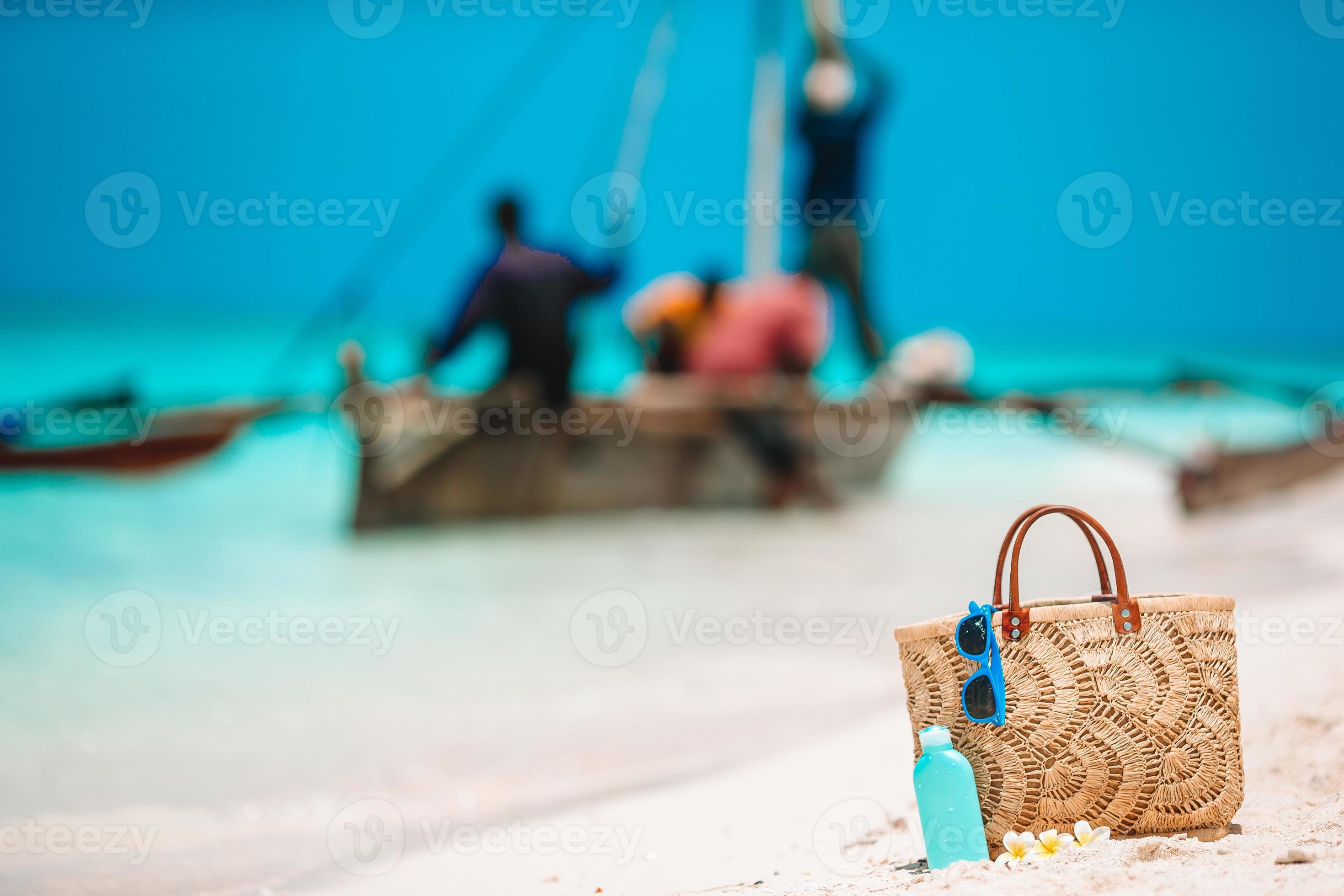 Beach accessories straw bag, hat and unglasses on the beach 17749838