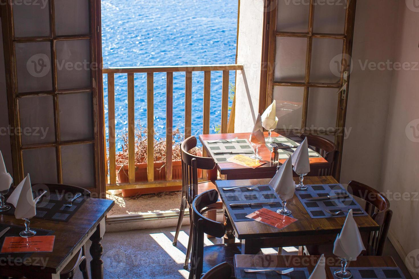 Served table set at outdoor cafe with perfect view photo