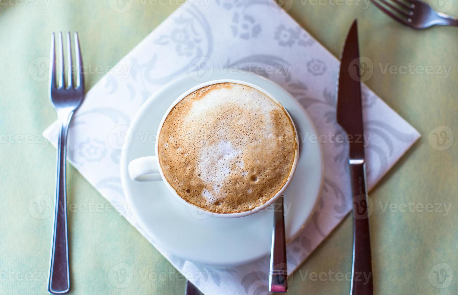 Delicious, aromatic cappuccino for breakfast at a cafe in the resort photo