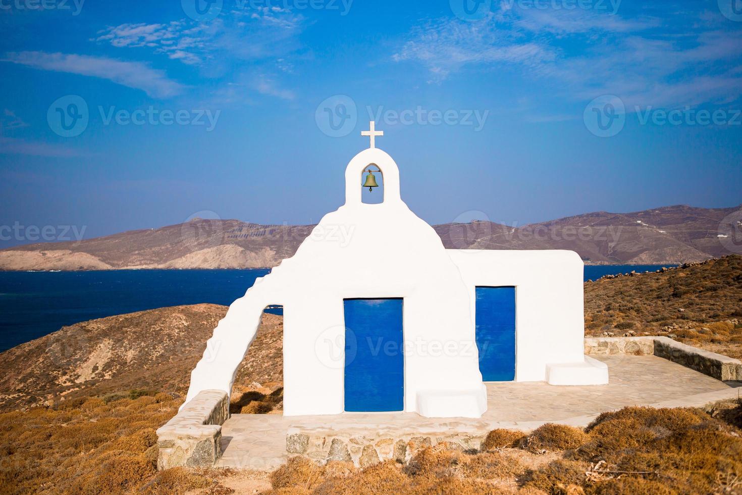 Traditional white church with sea view in Mykonos island,Greece photo