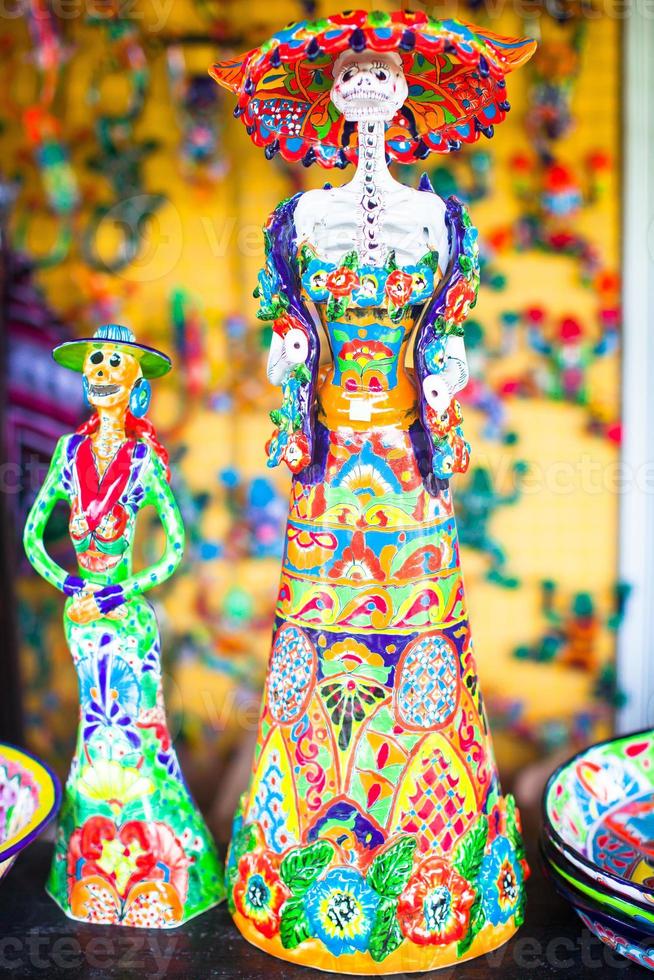 Colorful traditional mexican ceramics figures on the street market photo