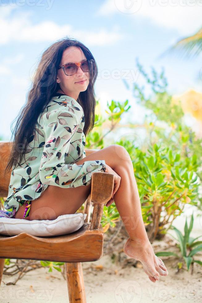 Beautiful woman outdoors at tropical vacation photo