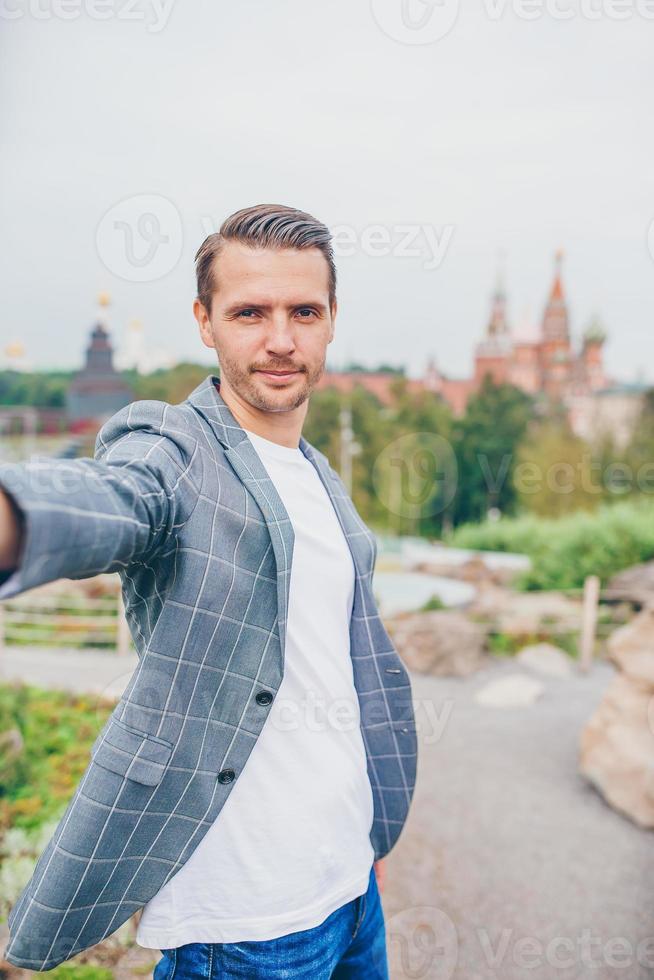 Happy young urban man enjoy his break in the city photo