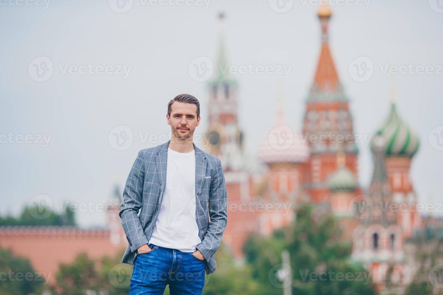 Happy young urban man in european city. photo