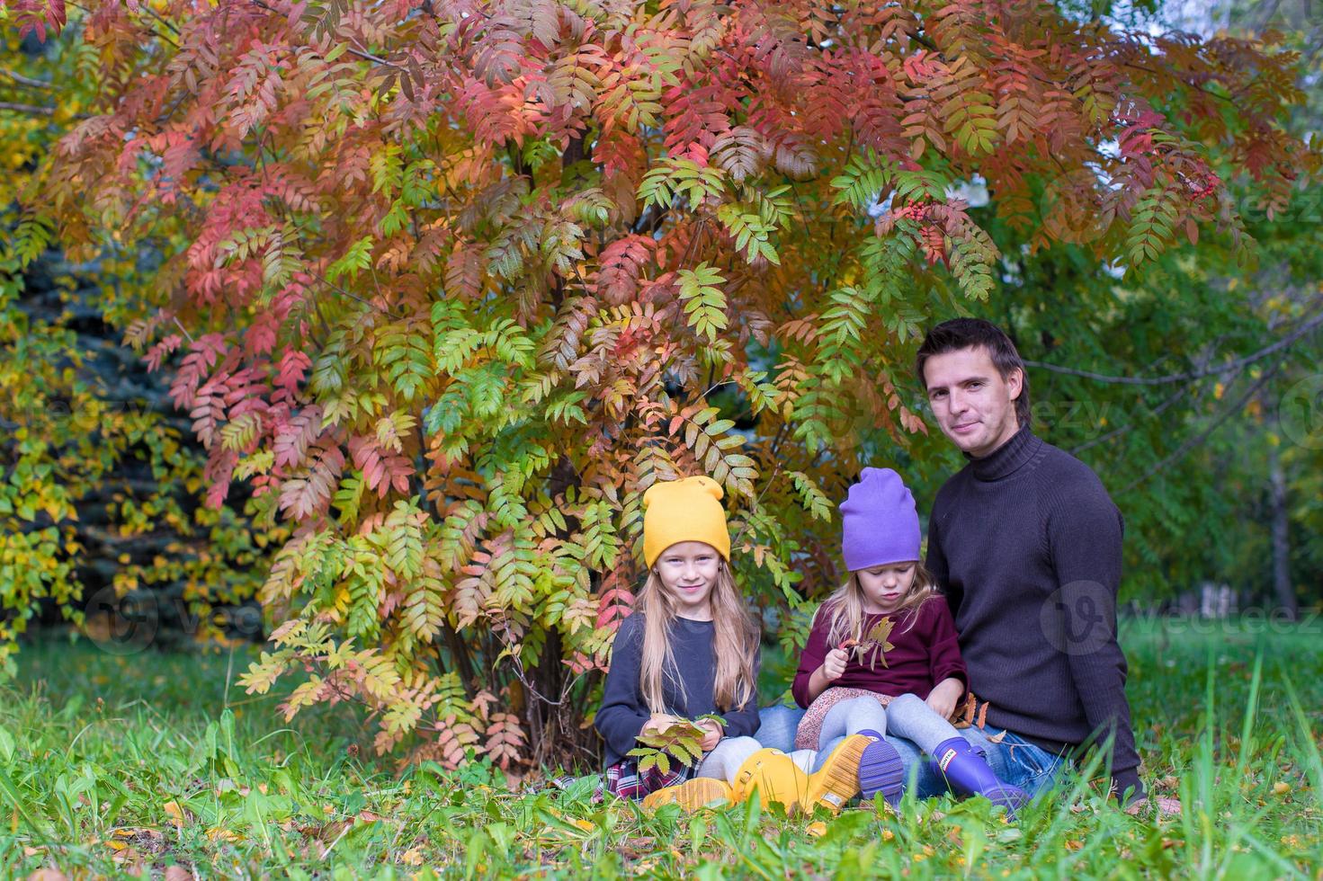 Happy family in autumn park outdoors photo