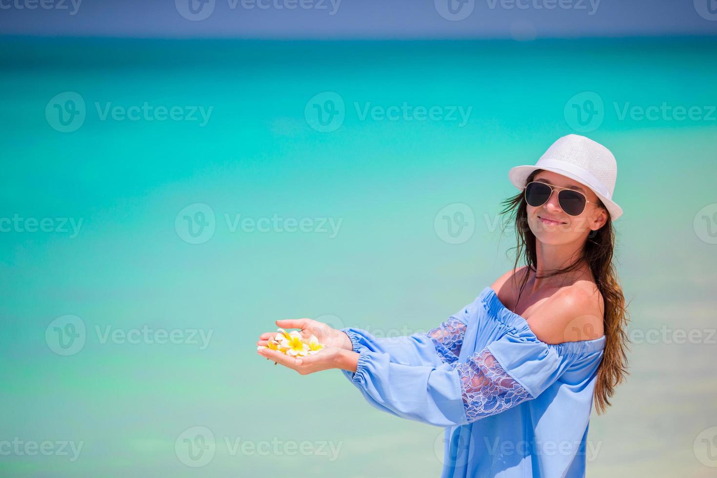 Young beautiful woman on beach vacation photo