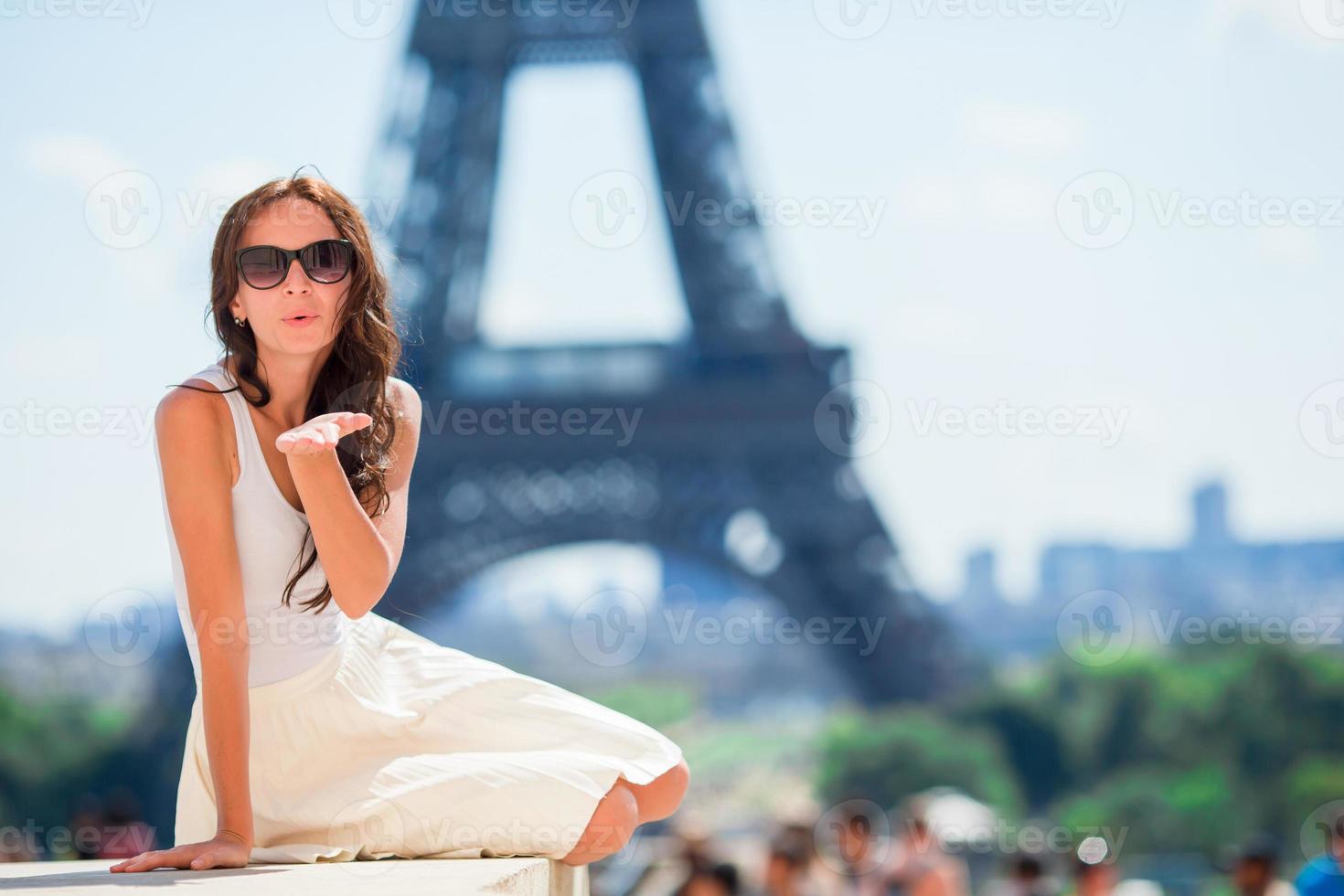 Beautiful woman in Paris background the Eiffel tower photo