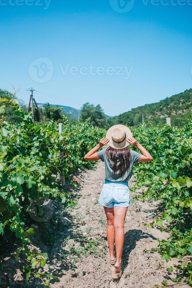 Woman in the vineyard in sun day photo