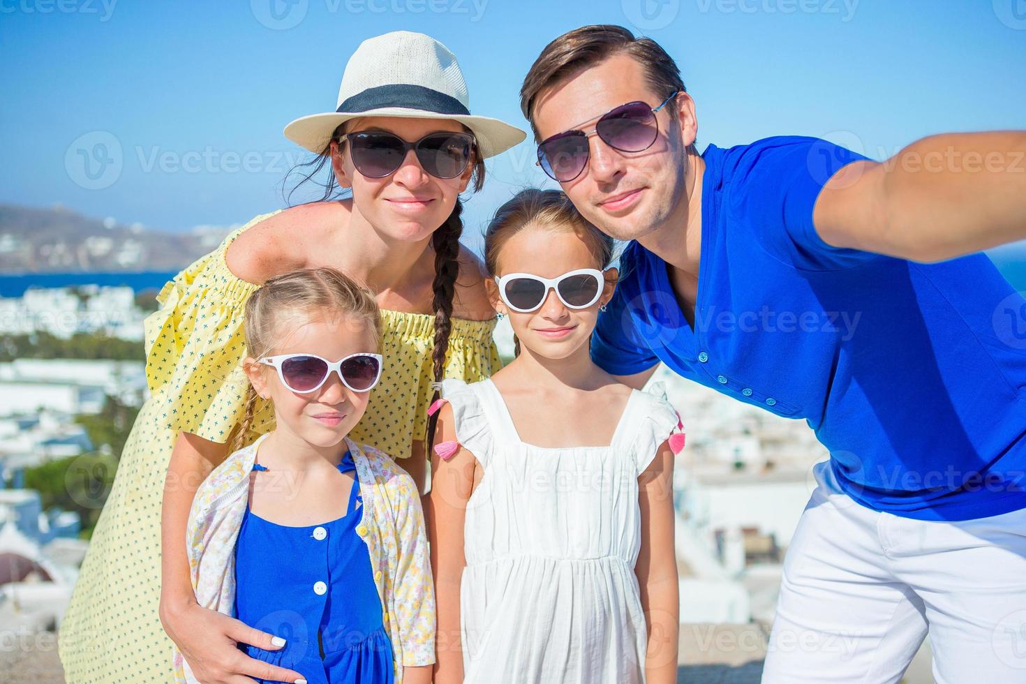 Family having fun outdoors on Mykonos island photo