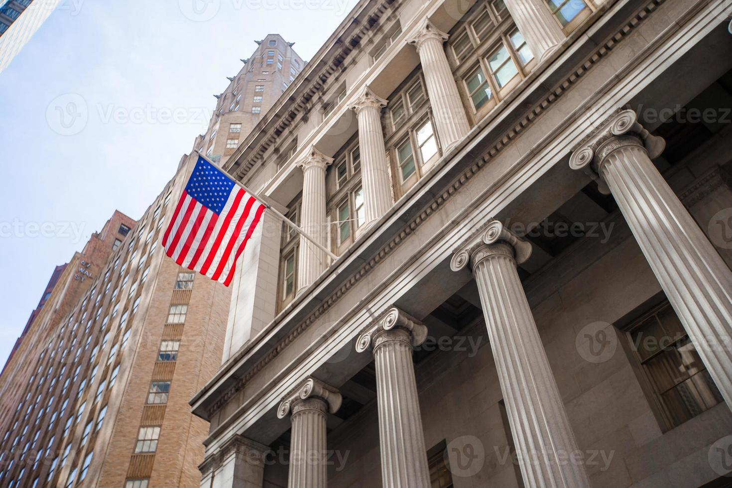 New York Stock Exchange in Manhattan Finance district. View of the building in the sky photo