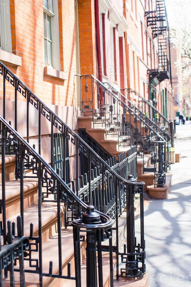 Old houses with stairs in the historic district of West Village photo