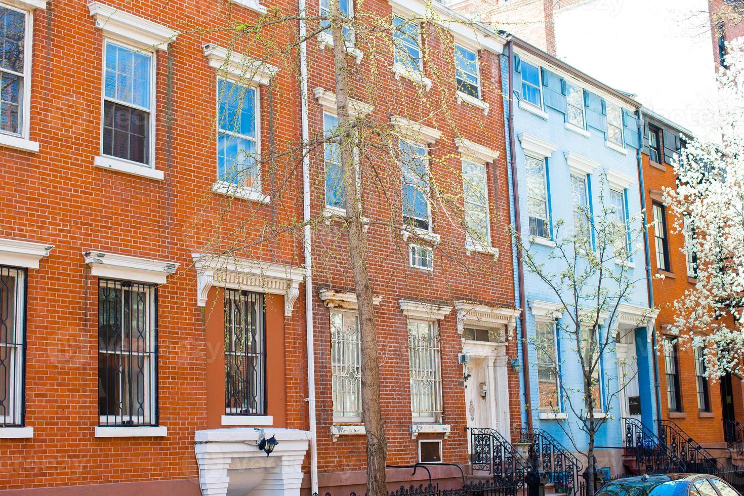 Old houses with stairs in the historic district of West Village photo