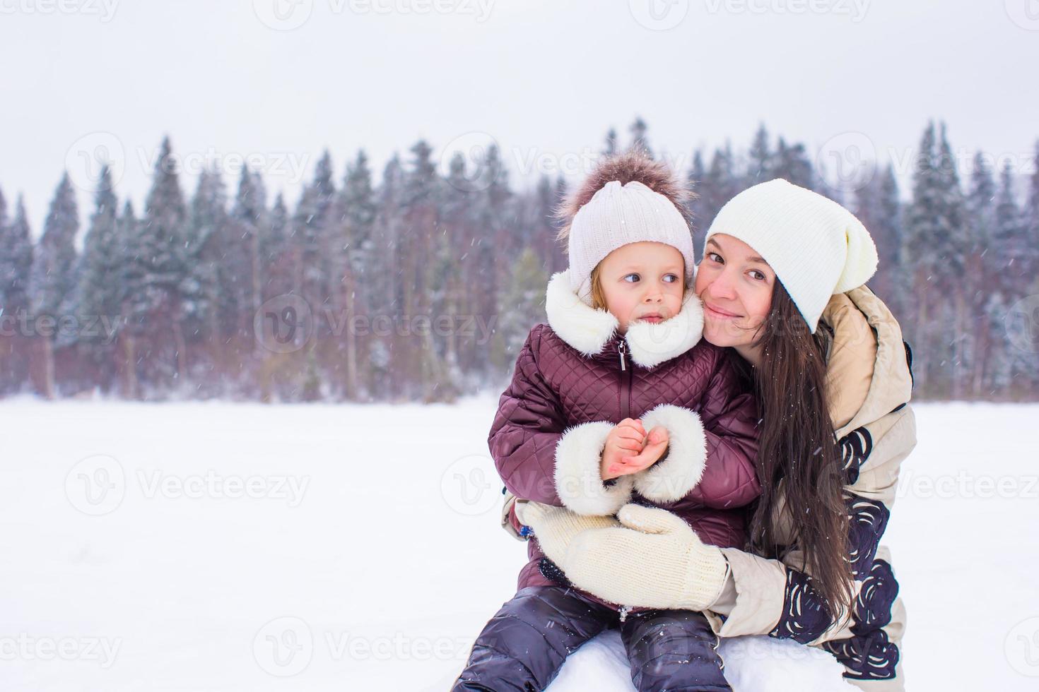 Happy family enjoy winter snowy day photo