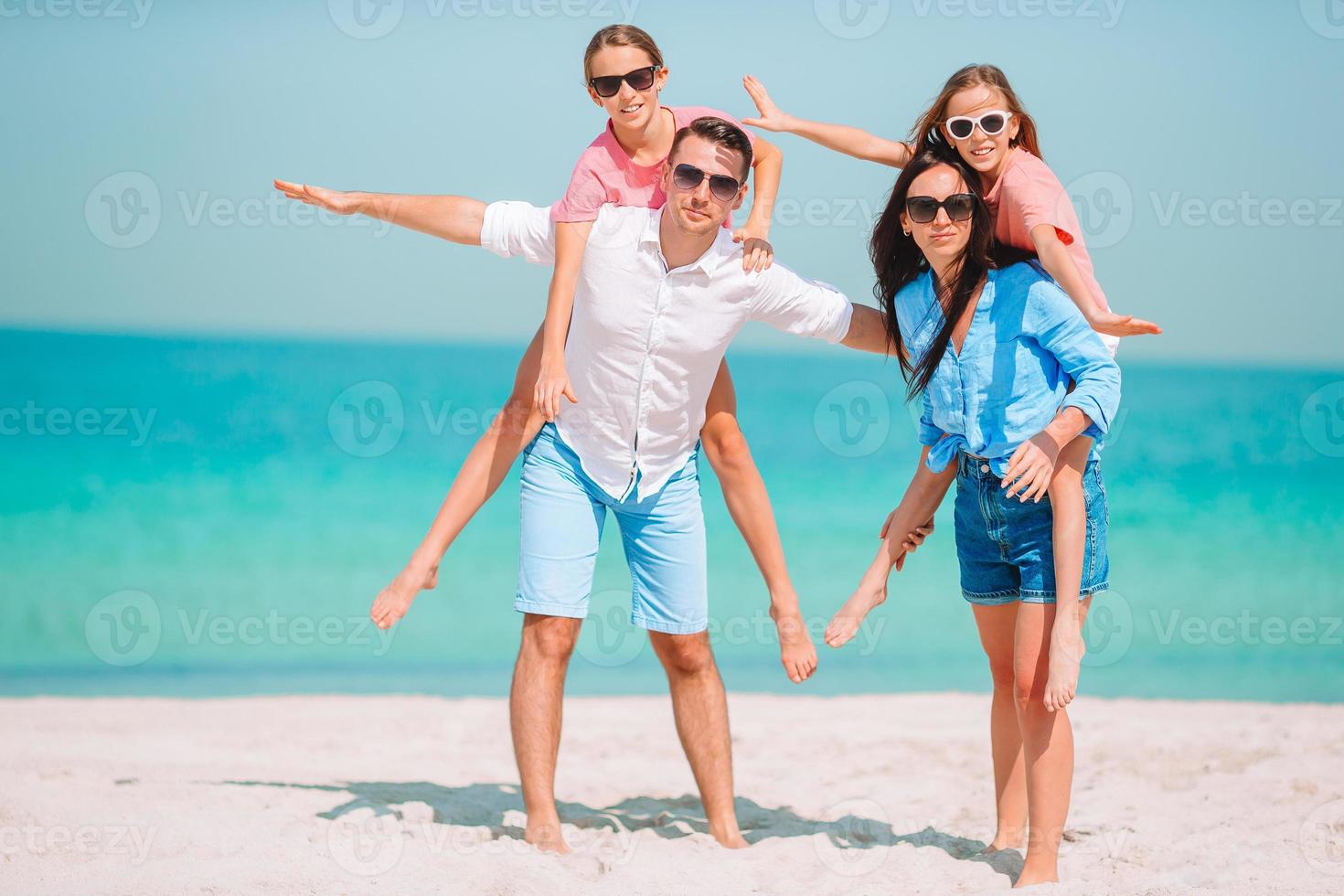 Photo of happy family having fun on the beach. Summer Lifestyle