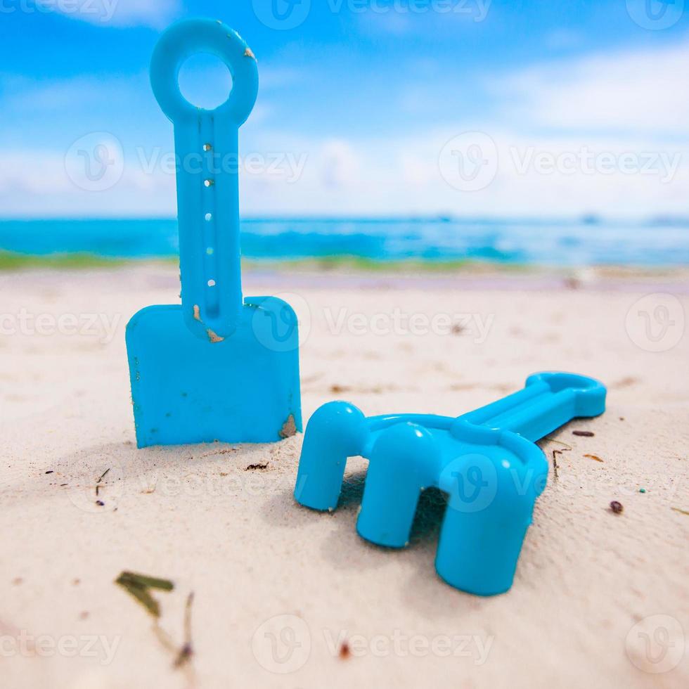Summer kid's beach toys in the white sandy beach photo