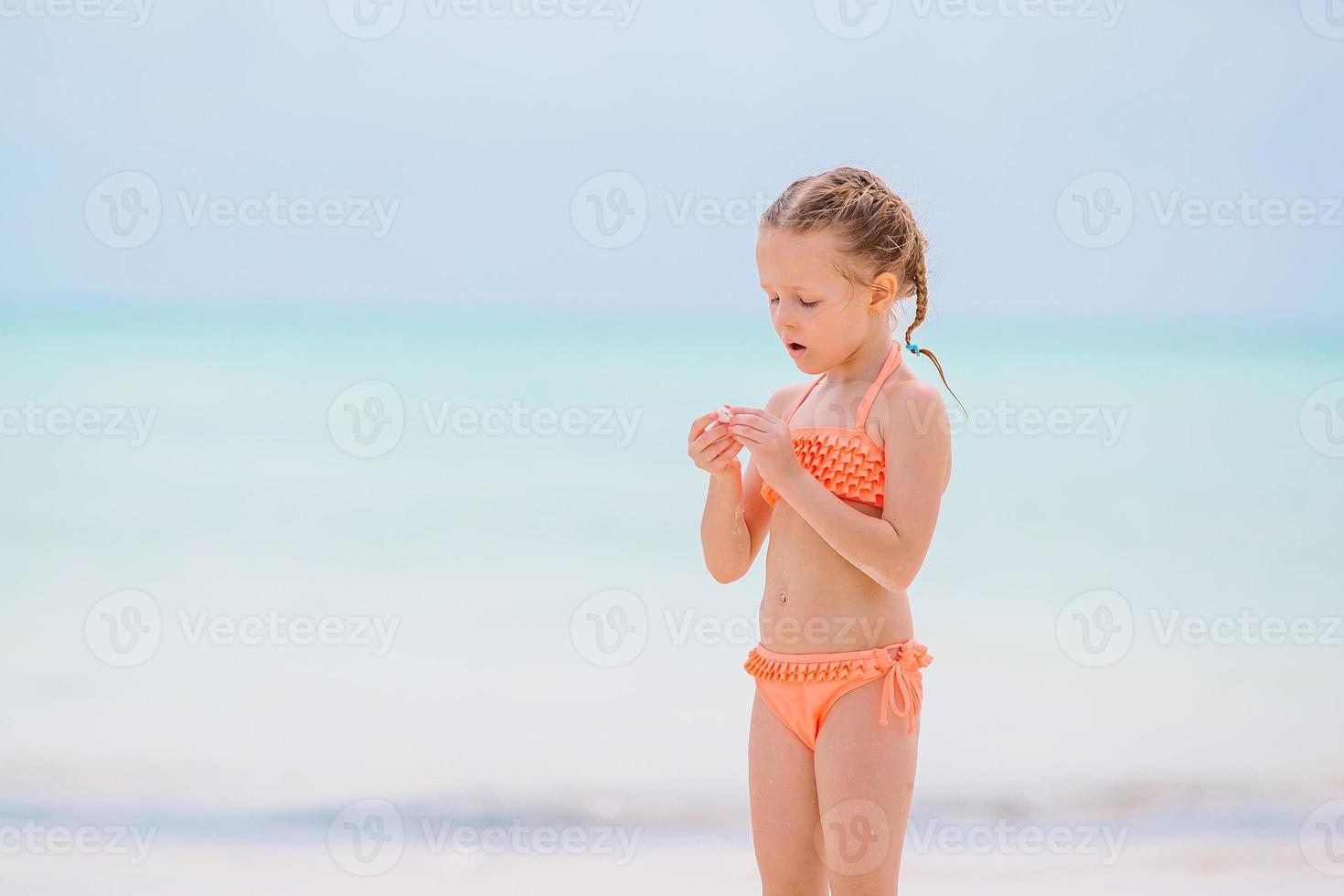 Happy girl enjoy summer vacation on the beach photo