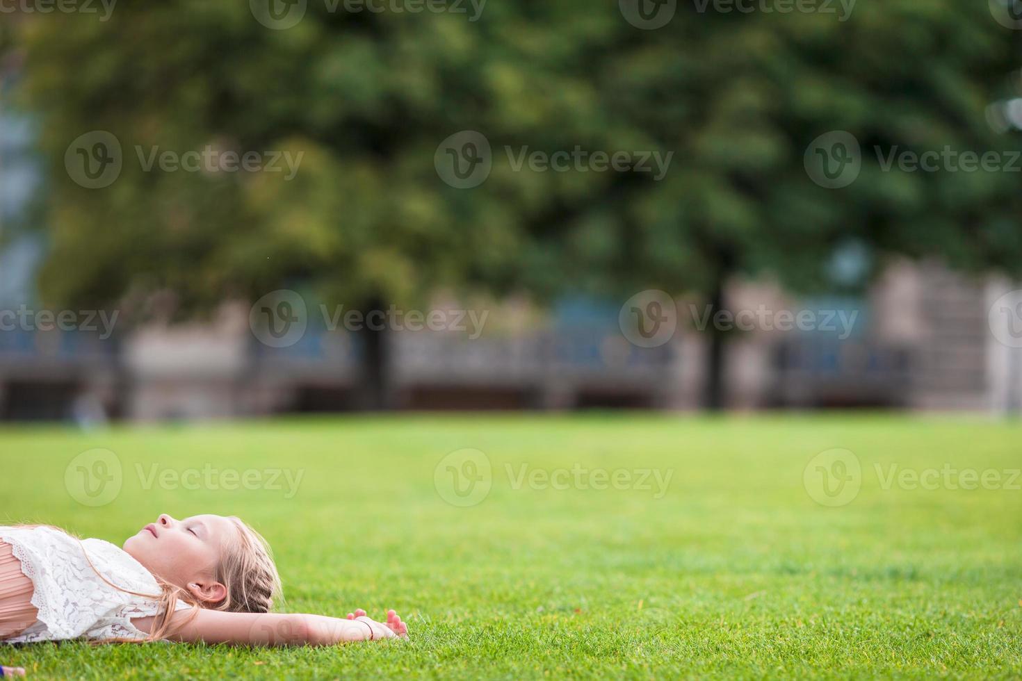 Adorable toddler girl in Paris during summer vacation photo