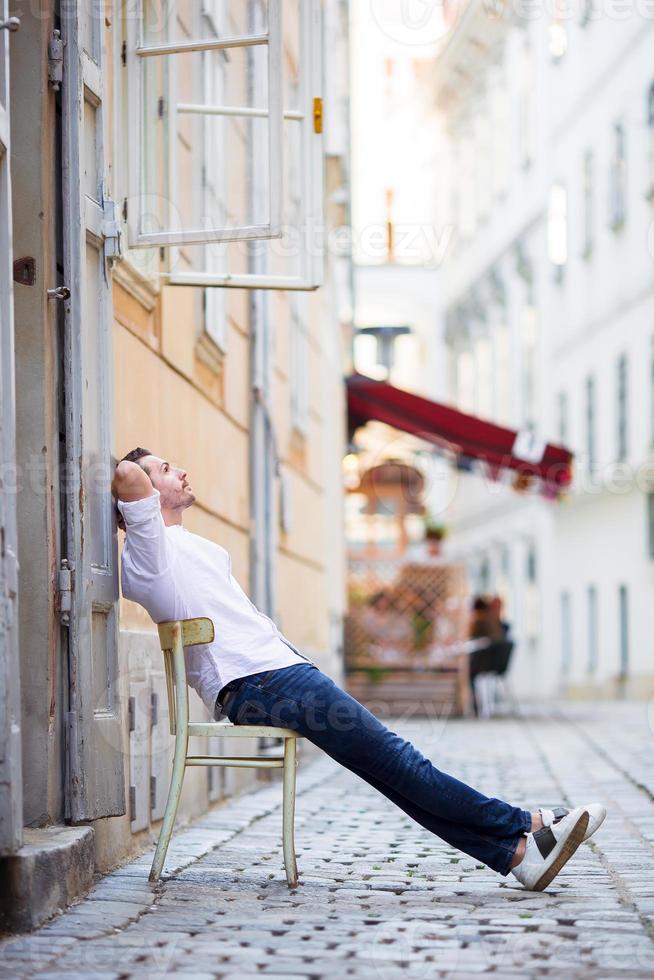 Young man background the old european city take selfie photo