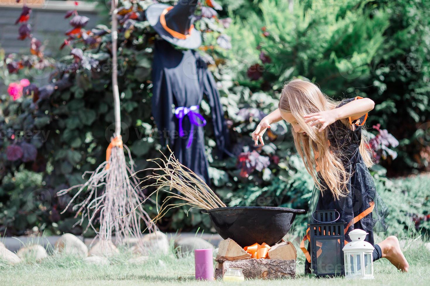 Happy girl in halloween costume with jack pumpkin.Trick or treat photo