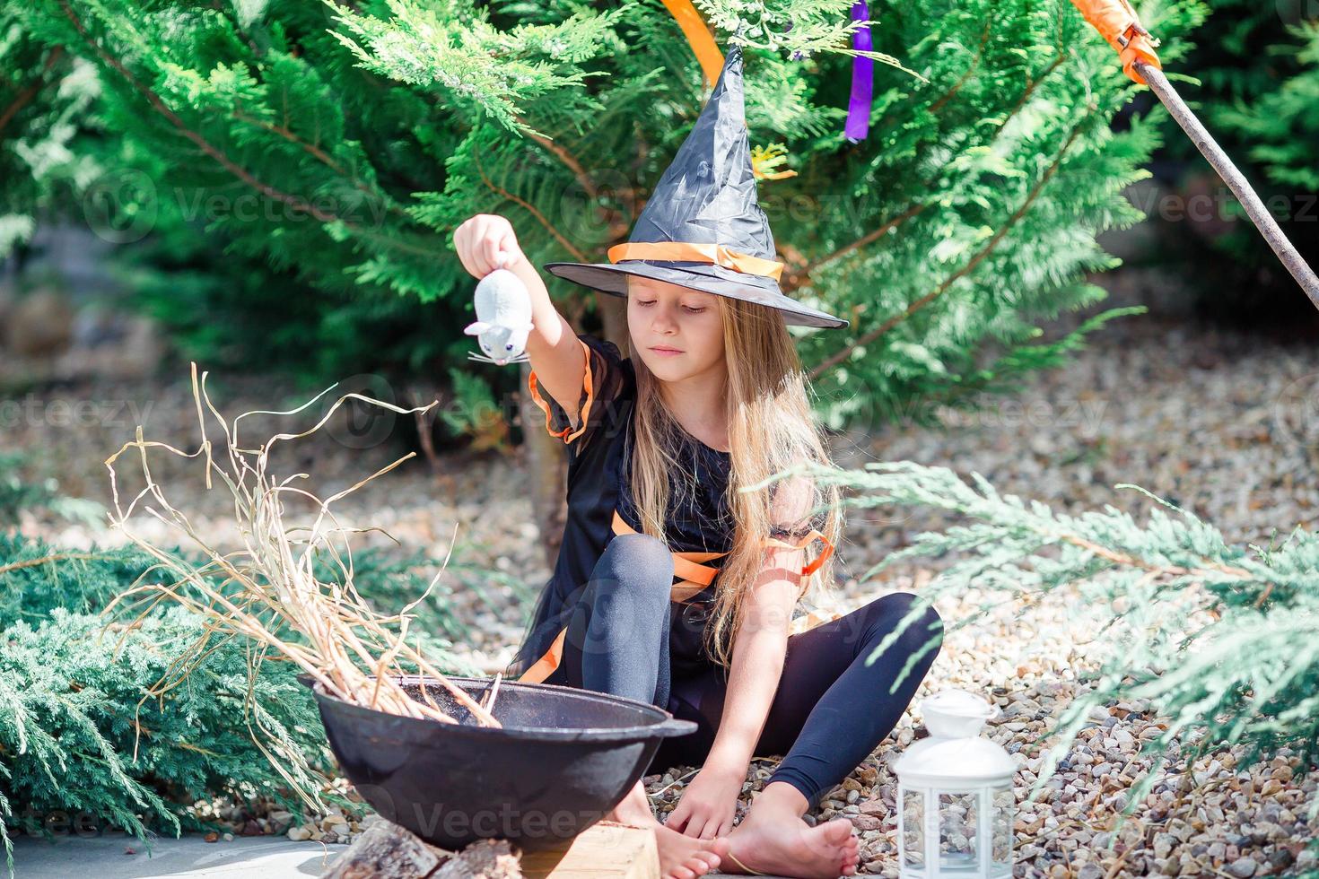 Happy girl in halloween costume with jack pumpkin.Trick or treat photo