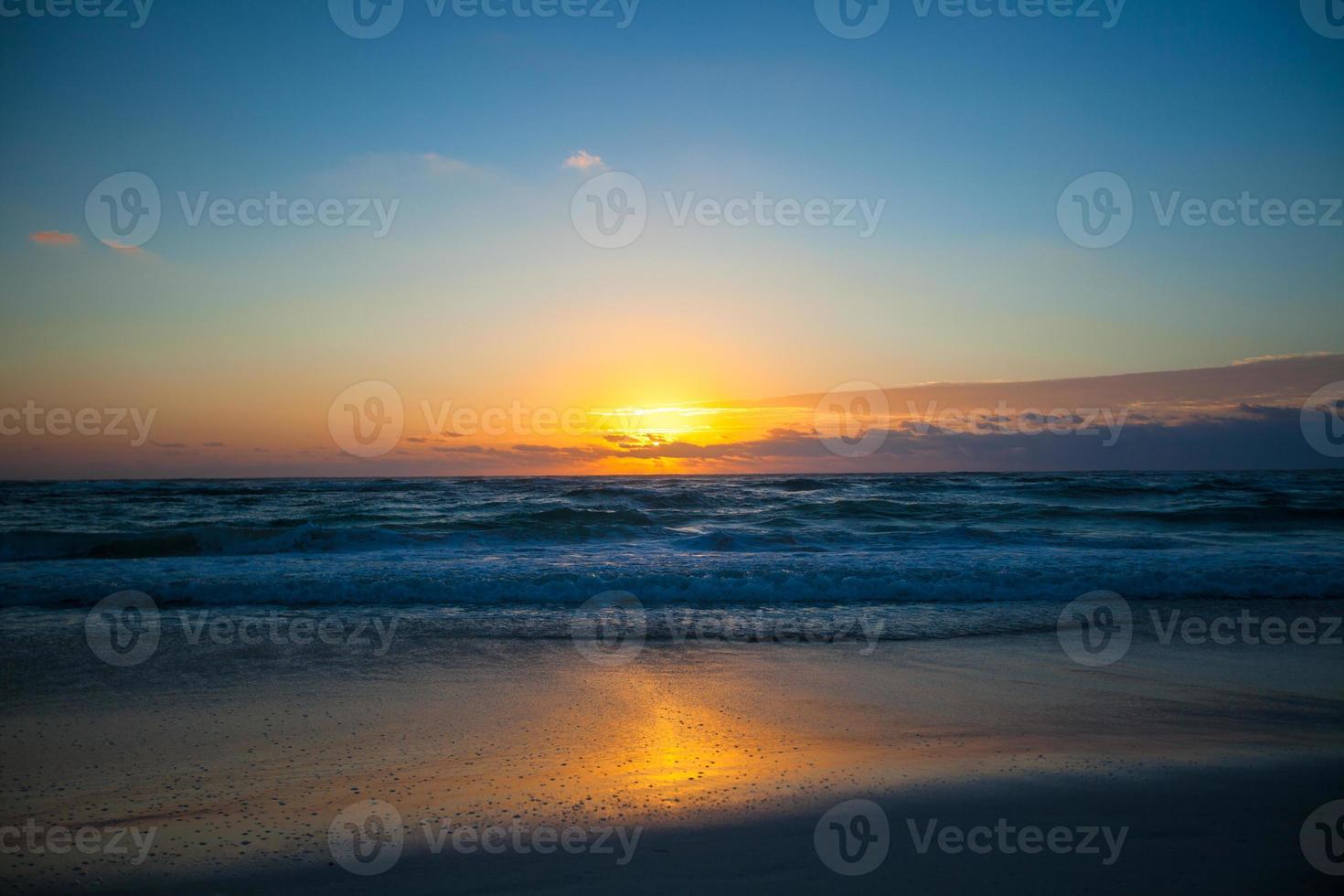 Stunning beautiful sunset on an exotic beach in Mexico photo