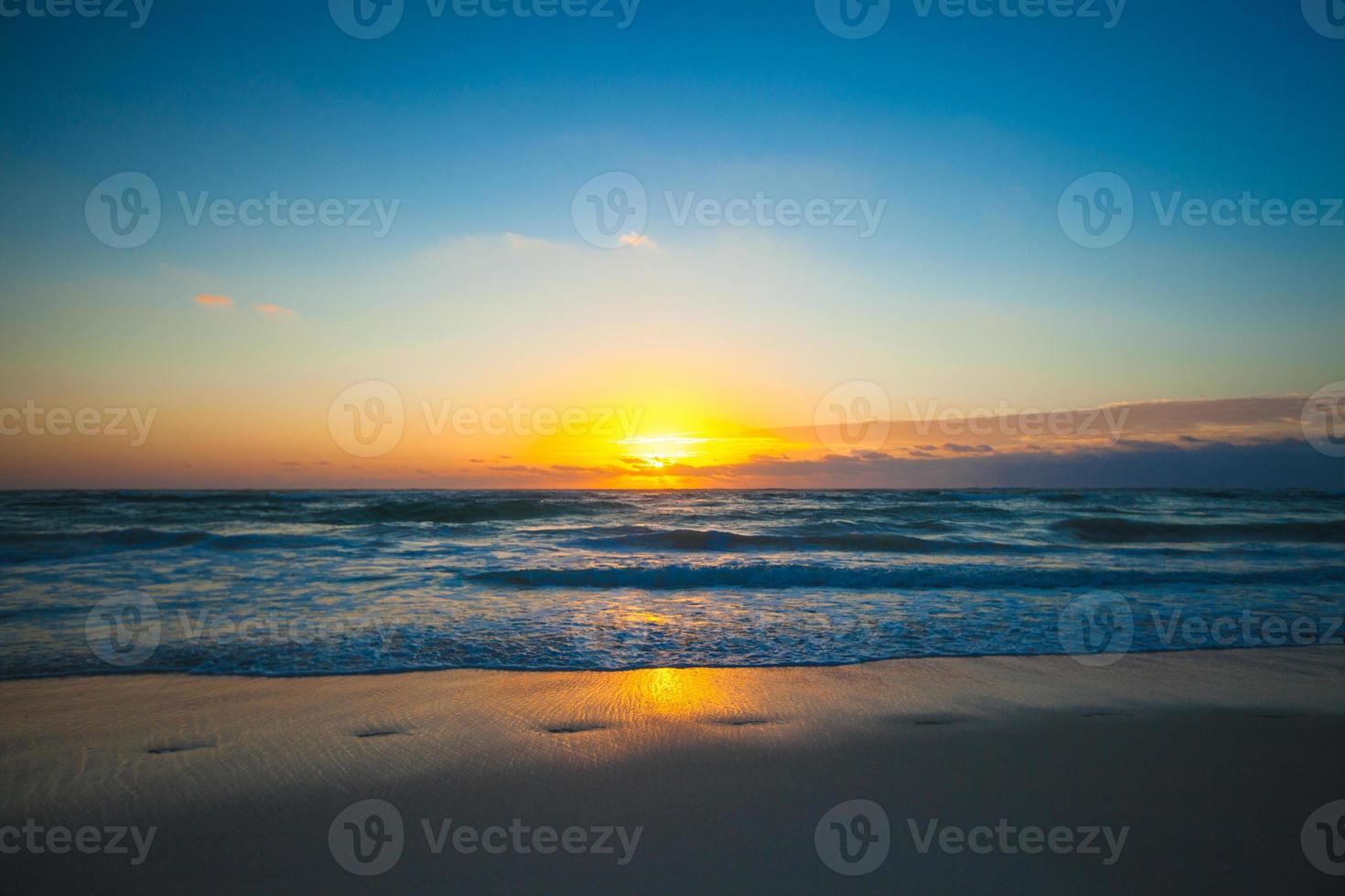 Amazing colorful sunset on exotic beach photo