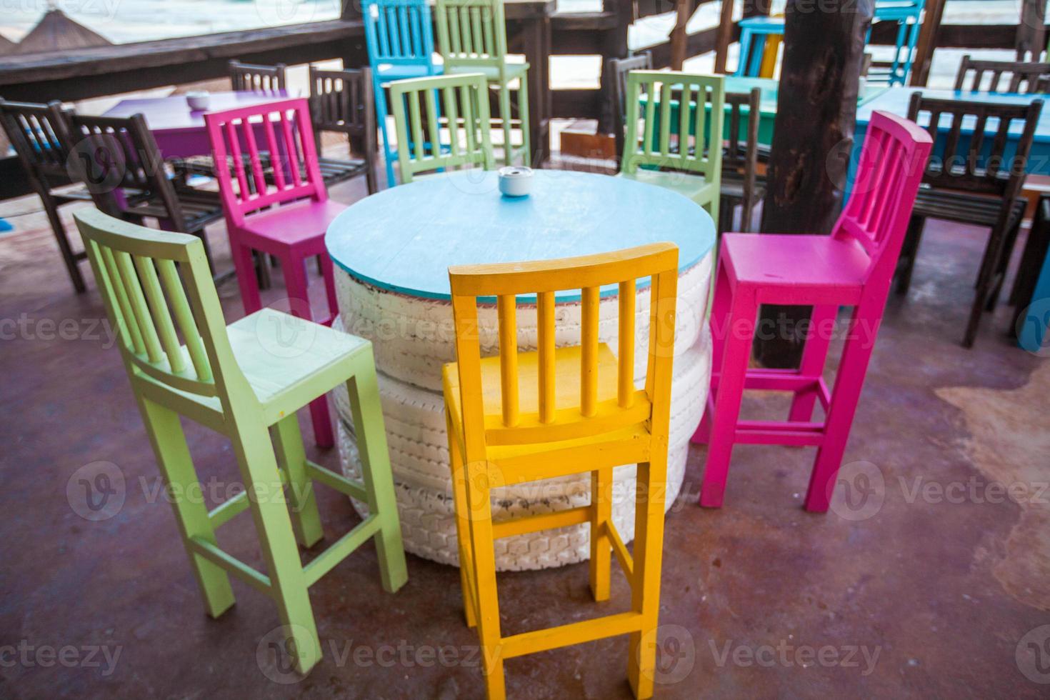 Bright colored bar-restaurant on the white sandy beach in Tulum photo