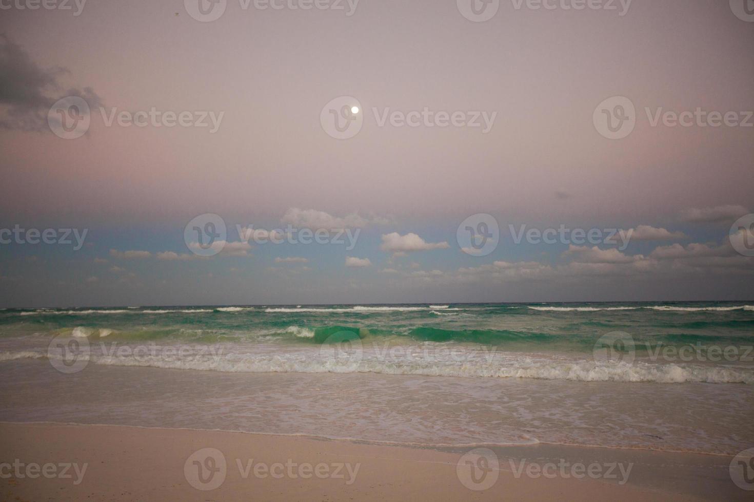 Amazing colorful sunset on exotic beach in Mexico photo