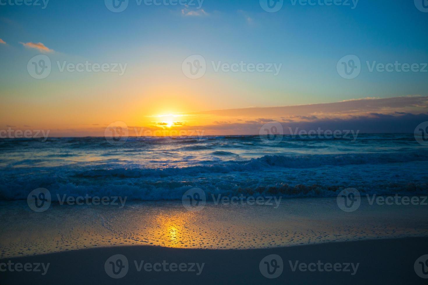 Amazing colorful sunset on the beach resort in Mexico photo
