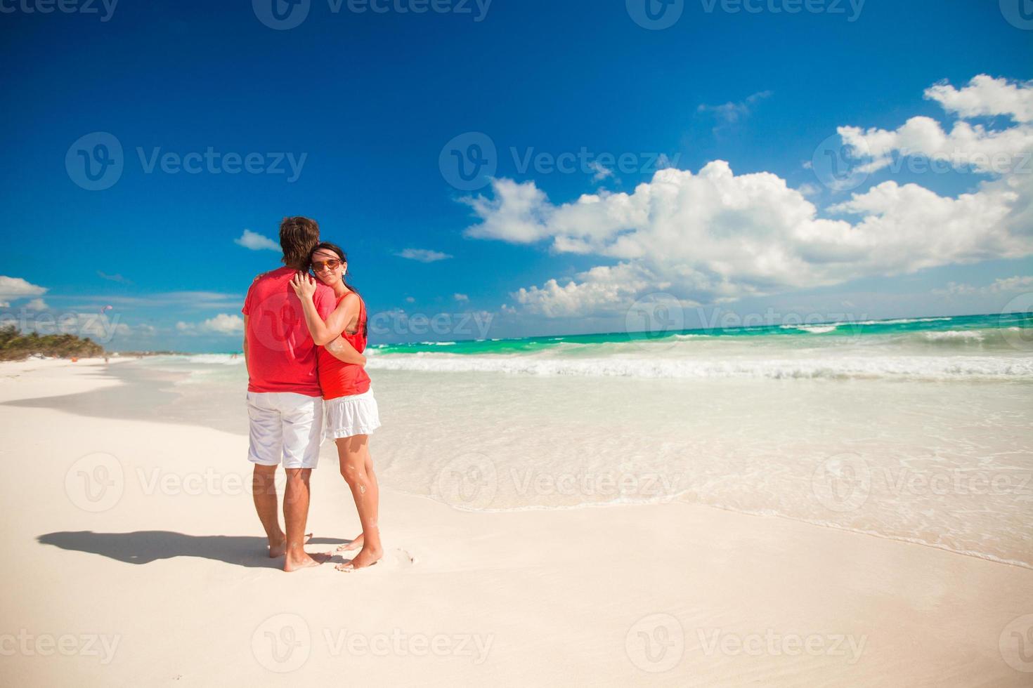 Young couple enjoying each other on a tropical beach photo