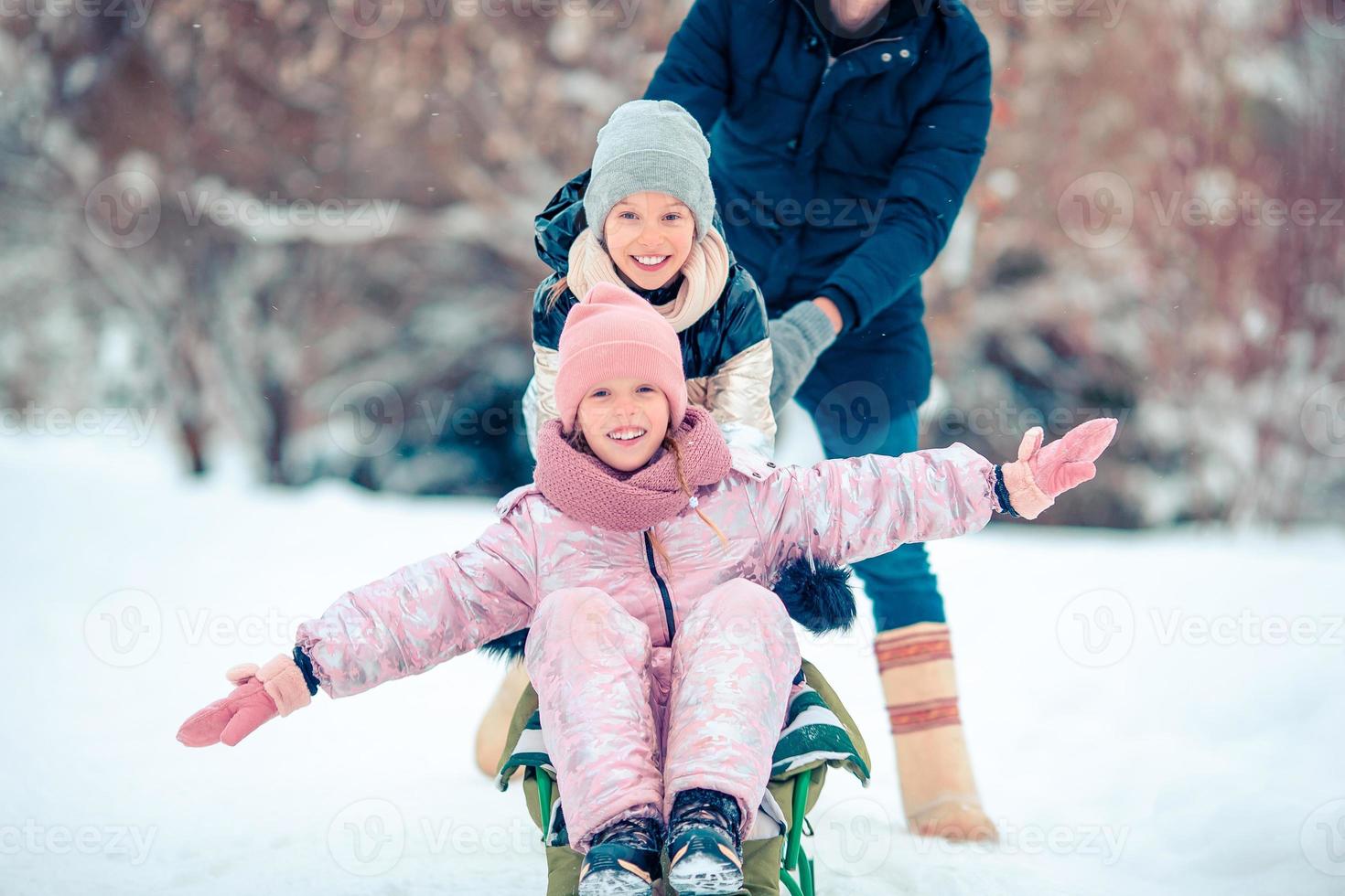 Family of dad and kids vacation on Christmas eve outdoors photo