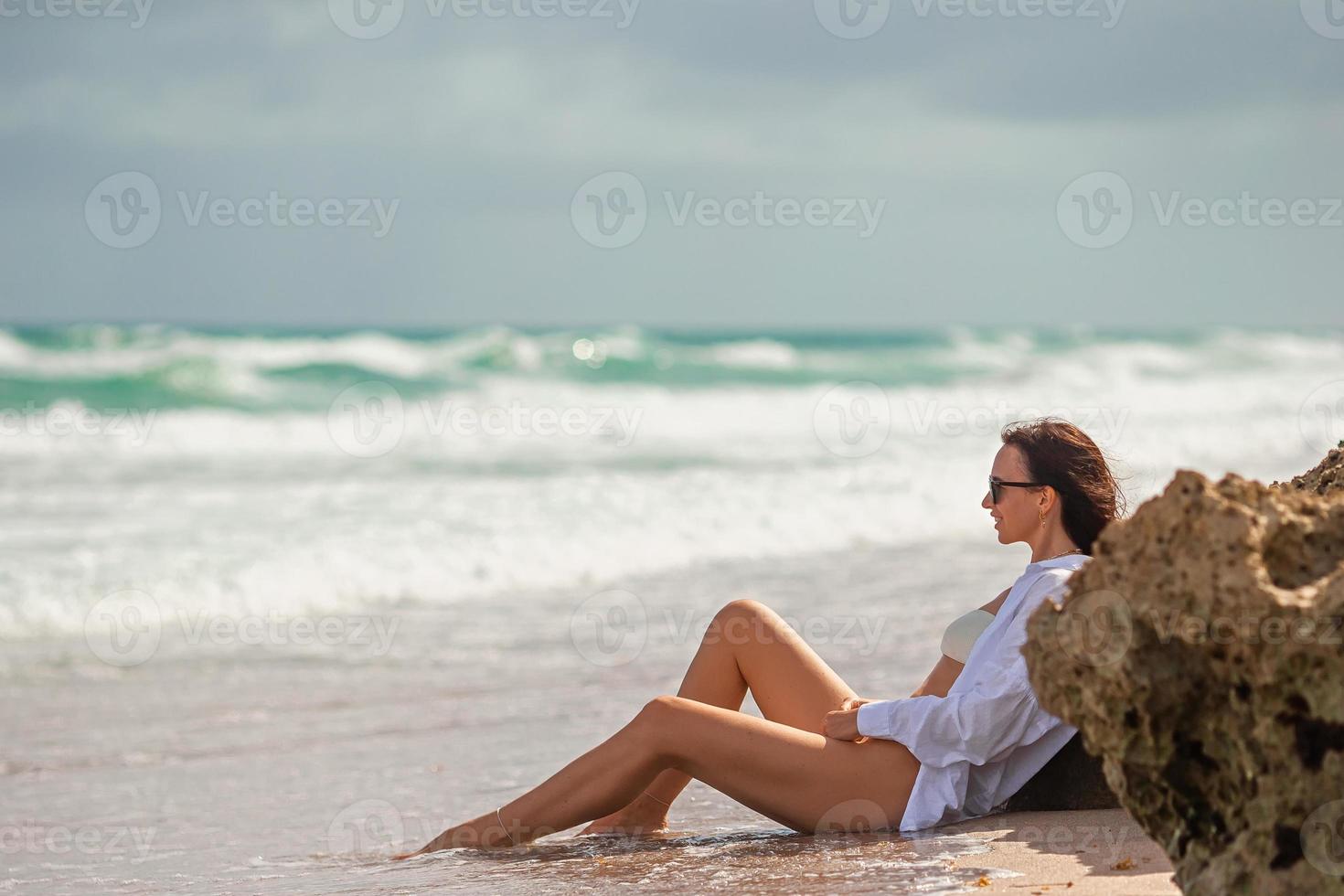 Young beautiful woman relax on the beach photo