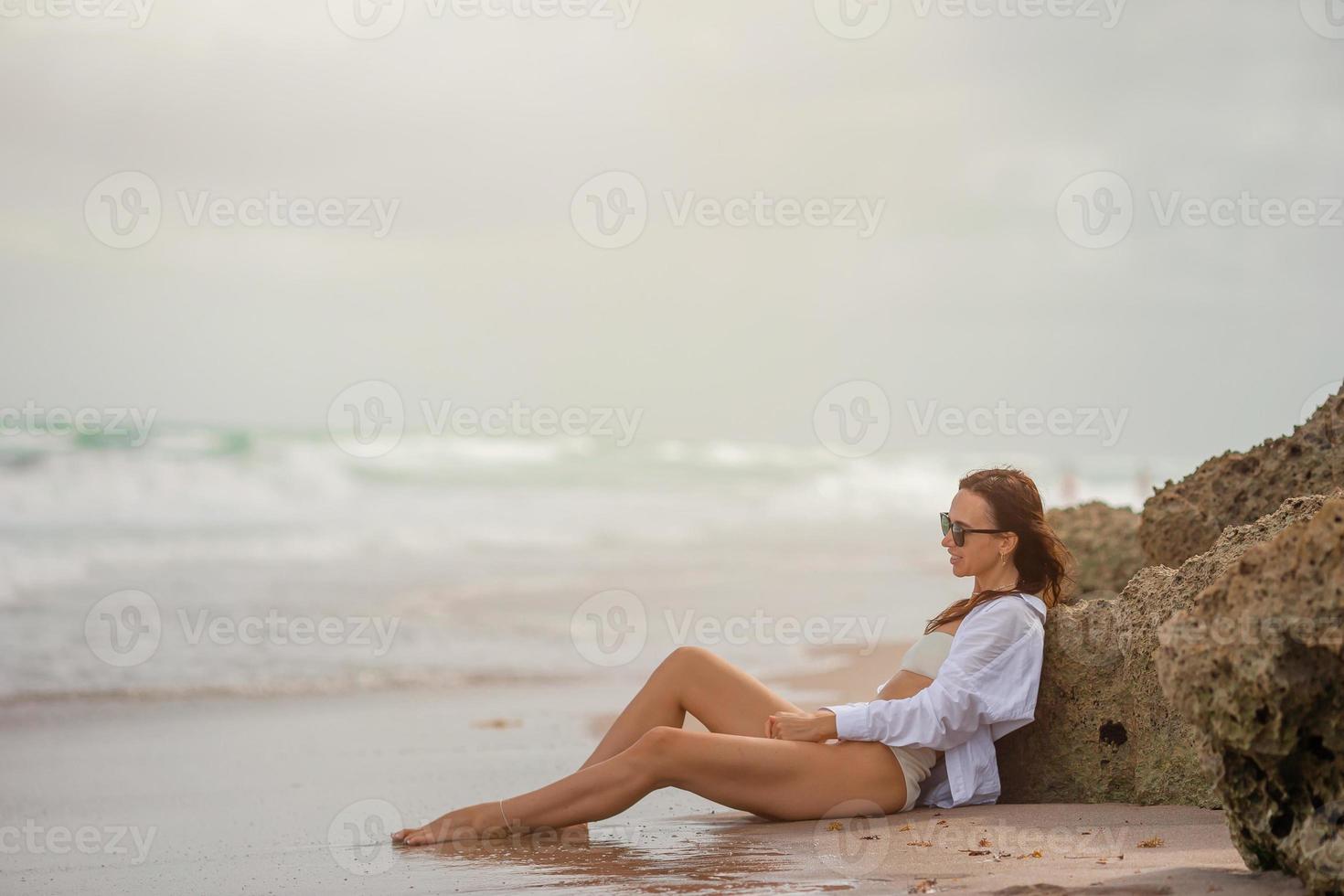 Young beautiful woman relax on the beach photo