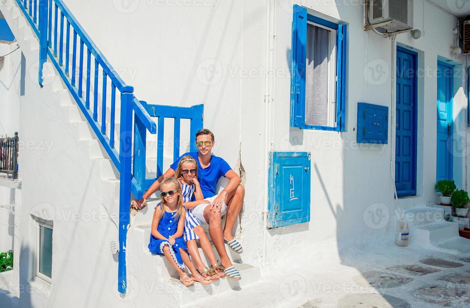 Family having fun outdoors on Mykonos island photo