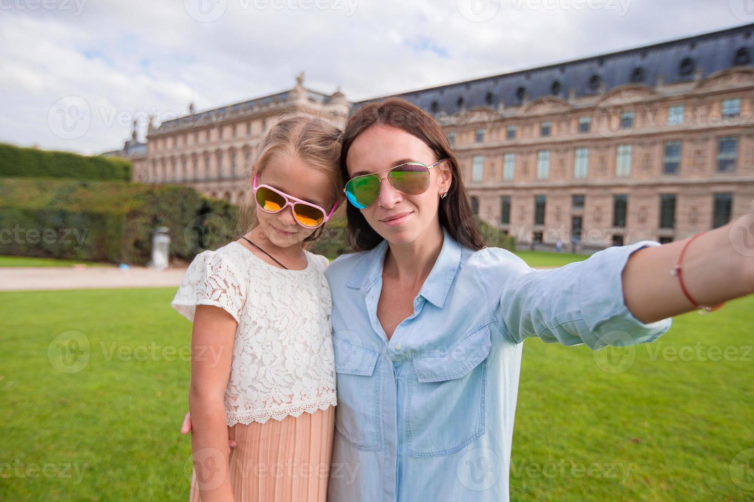 Happy mom and little kid taking selfie in Paris on french vacation photo