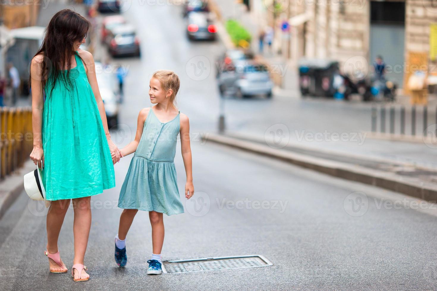 Happy mother and little adorable girl in Rome during summer italian vacation. Family european vacation. photo