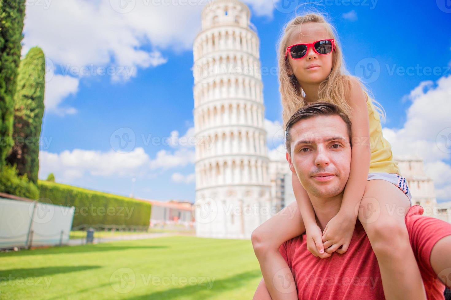 Family portrait background the Learning Tower in Pisa. Pisa - travel to famous places in Europe. photo