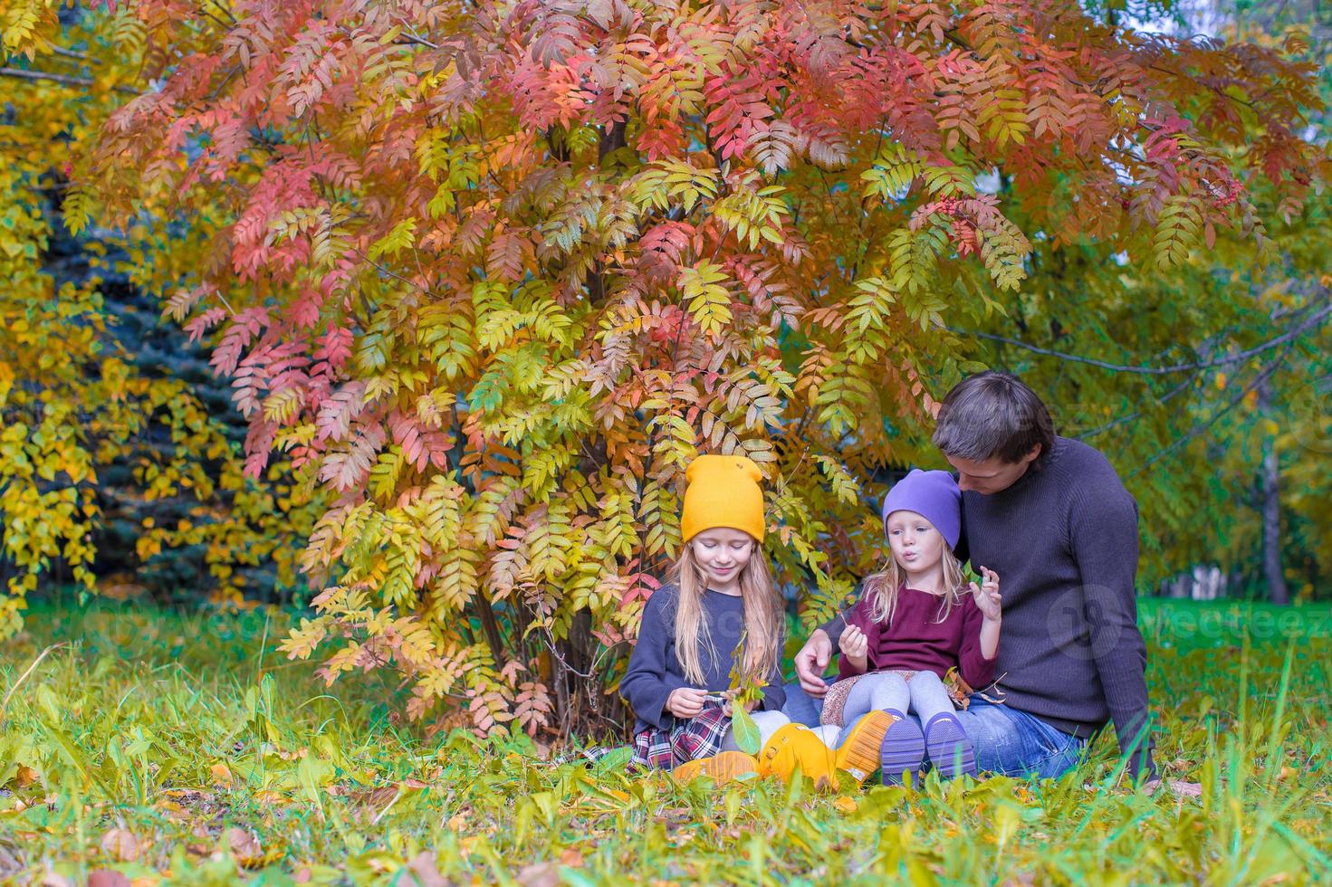 Happy family in autumn park outdoors photo