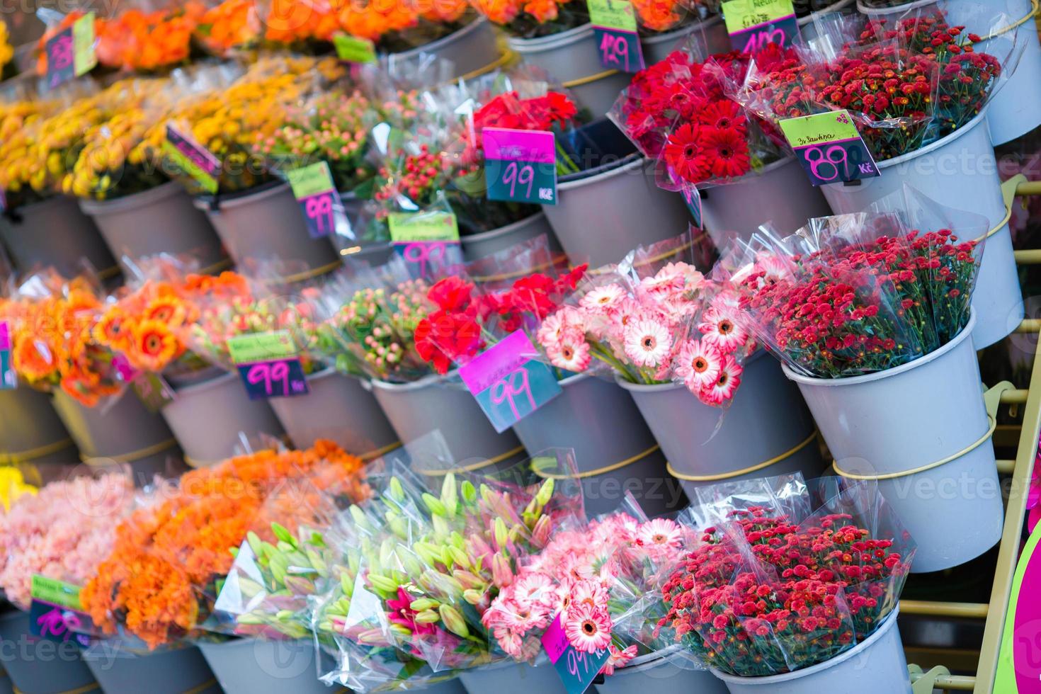 Street flower market with various multicolored fresh flowers outdoors in Europe photo