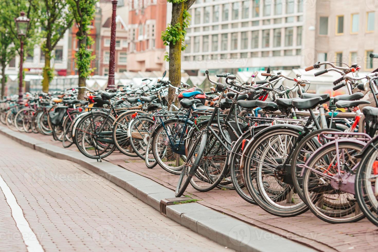 Bikes on the bridge in Amsterdam, Netherlands. Beautiful view of canals in autumn photo