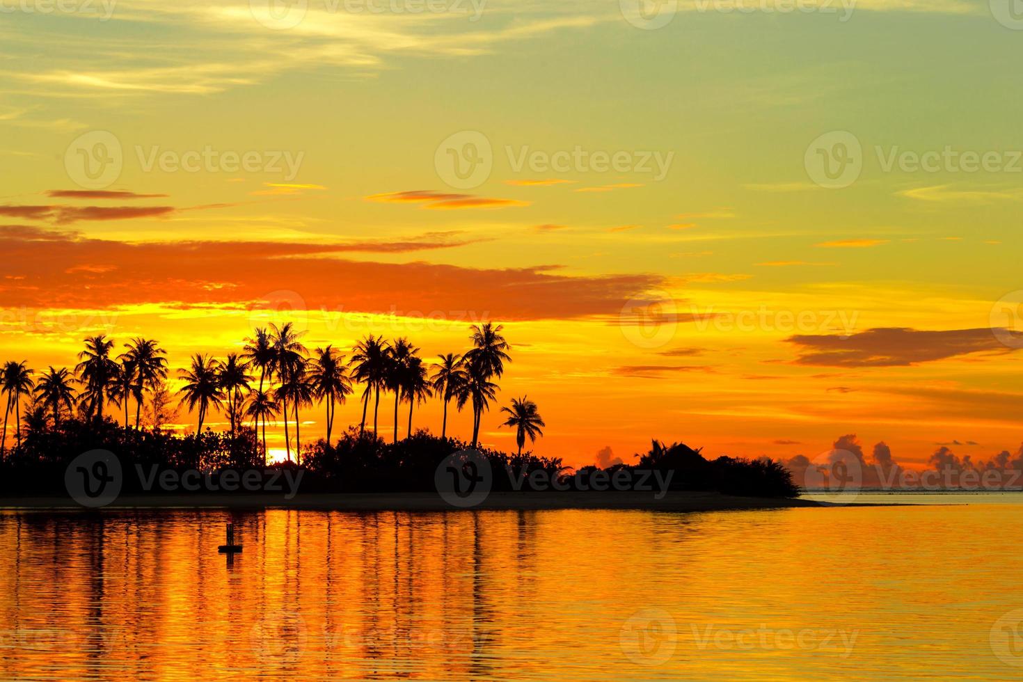 Beautiful colorful sunset at tropical island on Maldives in Indian Ocean photo