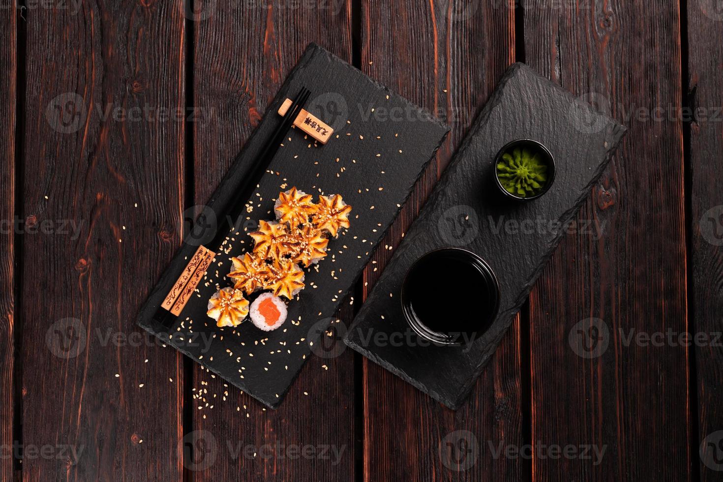 Japanese hot maki roll sushi with salmon top view - asian food concept photo