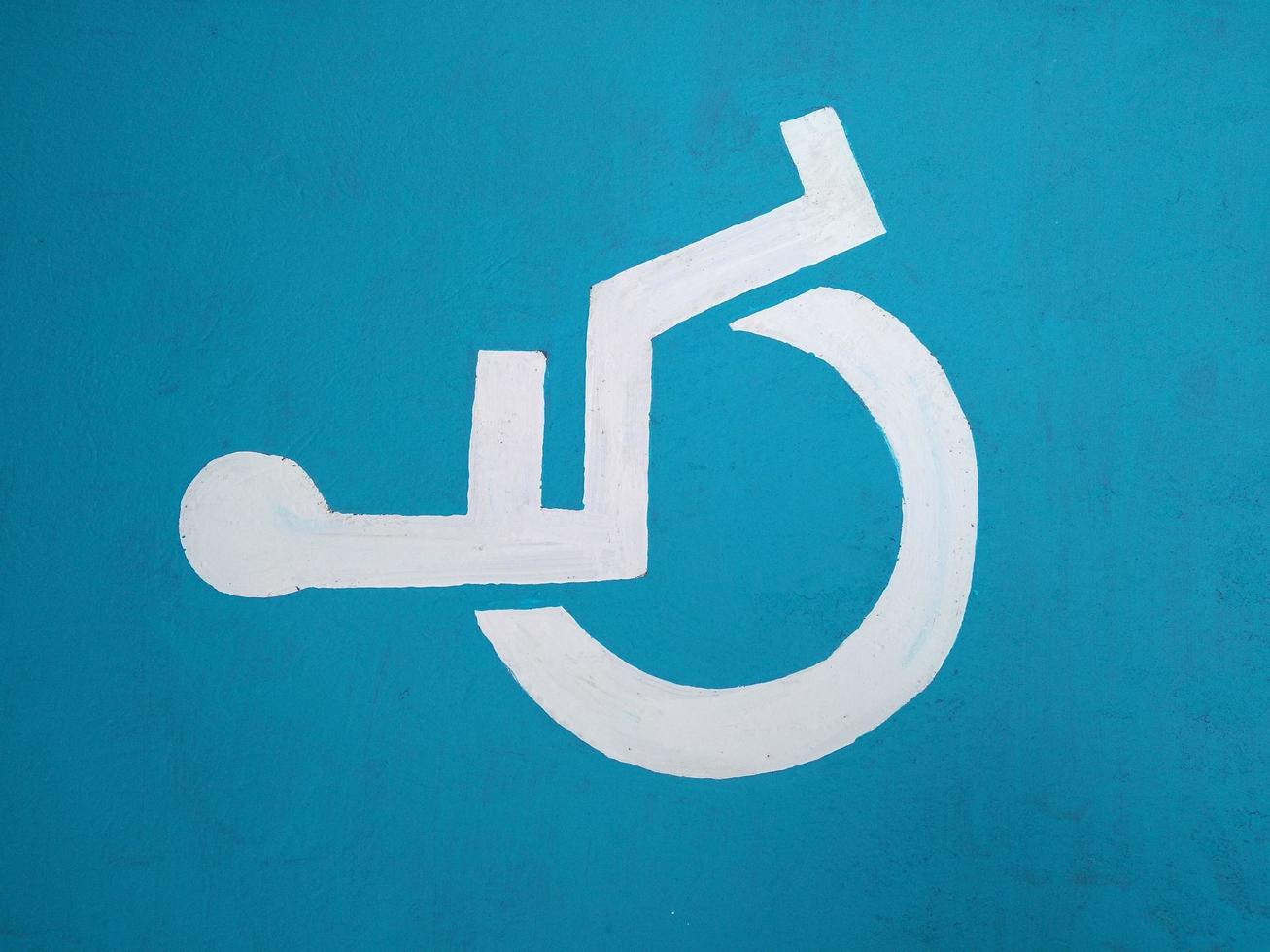 Wheelchair, handicapped or accessibility parking or access sign flat blue icon for apps and print photo